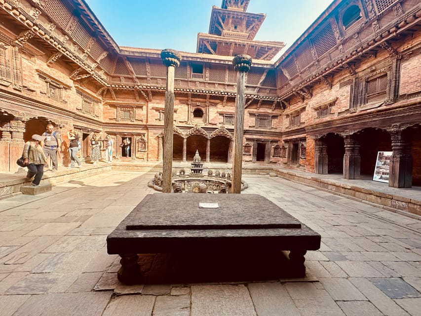 Kathmandu: 7 UNESCO-Listed city sites group day trip - Bhaktapur Durbar Square near twilight: medieval streets on the clock