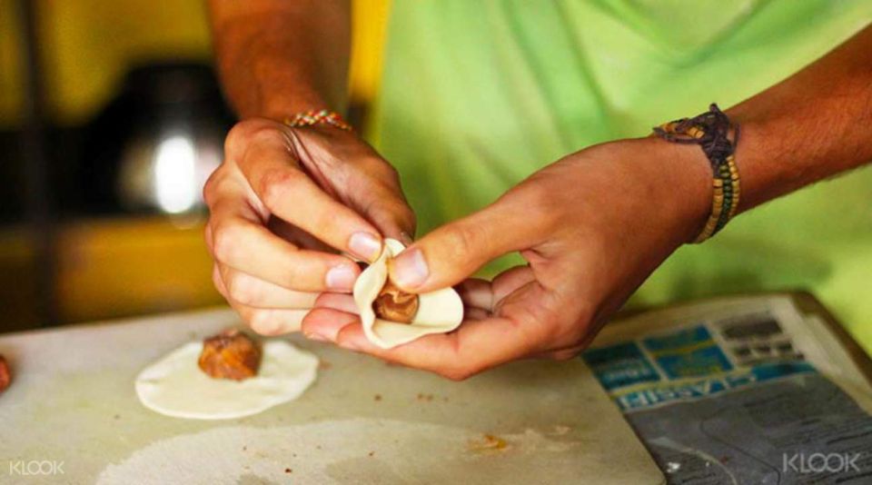 Kathmandu: Nepali Cooking Class with Hotel Pickup - Back in the kitchen: momo, curries, roti-style bread, and sel roti